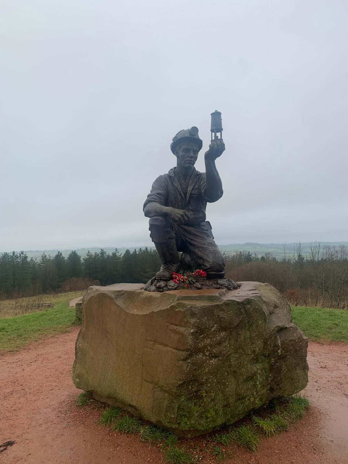 bronze statue of a miner